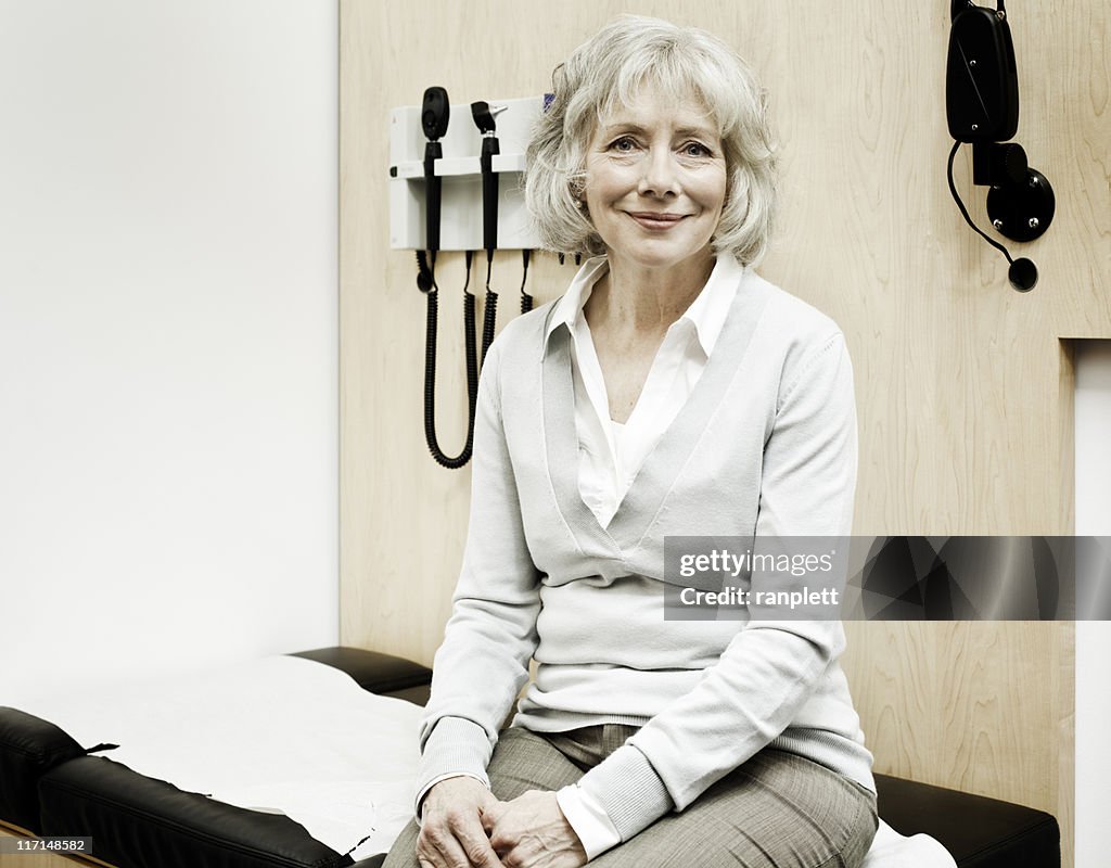 Senior Woman Sitting on an Examination Table