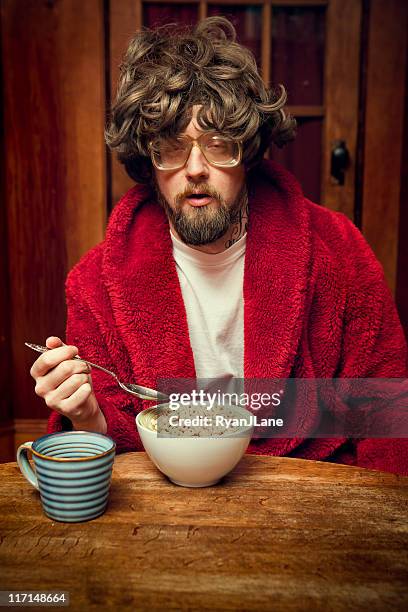 tired nerd man eating cereal and coffee - ugly people stock pictures, royalty-free photos & images