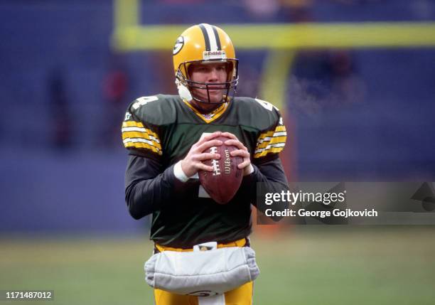 Quarterback Brett Favre of the Green Bay Packers looks on from the field before a game against the Cleveland Browns at Cleveland Municipal Stadium on...