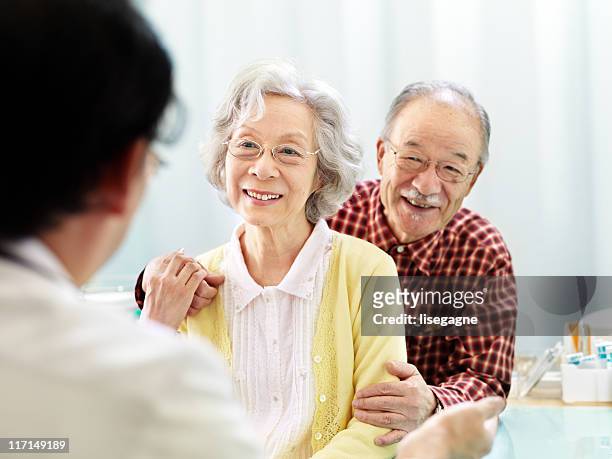 patients with doctor - the japanese wife stock pictures, royalty-free photos & images