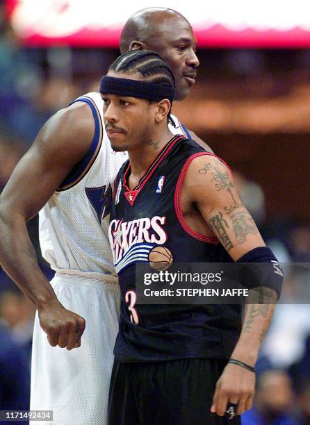 Washington Wizards' Michael Jordan greets Philadelphia 76ers' Allen Iverson prior to the start of their game 22 January 2002 at the MCI Center in...