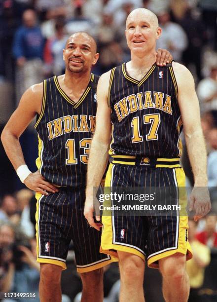 Indiana Pacers Mark Jackson and Chris Mullin smile as Reggie Miller sinks two at the foul line in the final minutes of game action against the...