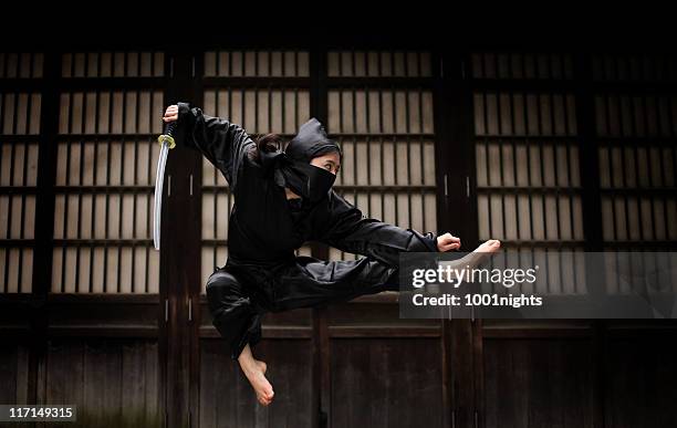 asian woman showing her ninja moves - karate woman stock pictures, royalty-free photos & images