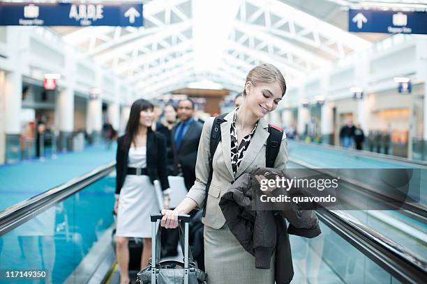 airport business travel, young woman checking phone, copy space - tall blonde women stock pictures, royalty-free photos & images