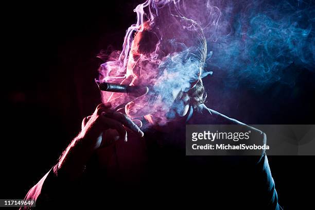 cigar smoker - cigar smokers stock pictures, royalty-free photos & images