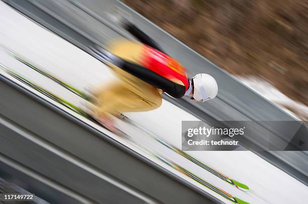 ski jumper at the inrun section - ski jumping stock pictures, royalty-free photos & images