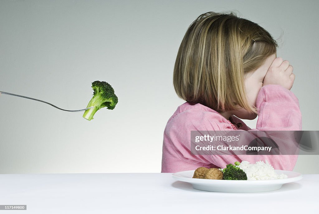 Essayer d'obtenir un enfant de manger ses Greens