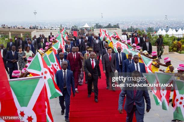 Burundi's President Pierre Nkurunziza walks on the red carpet as he arrives to inaugurate the new state house constructed by the Chinese aid in...