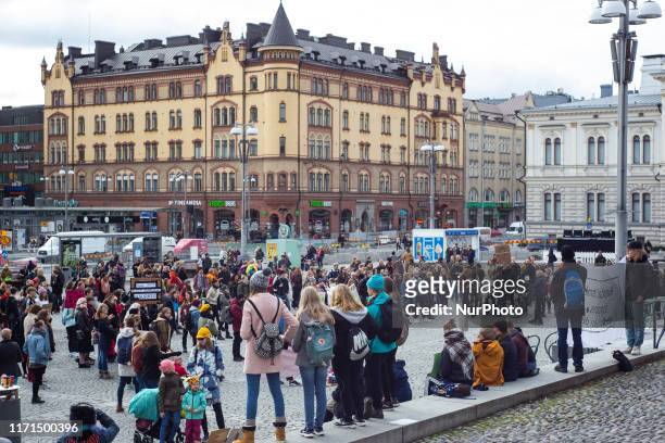 School students and activists take part in the Global Climate Strike in the centre of Tampere, Finland on Friday, September 27, 2019. Many students...