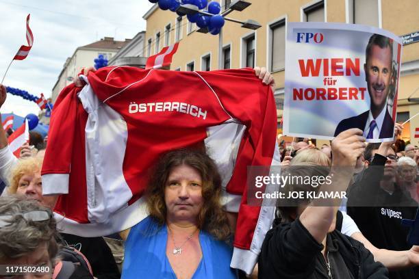 Supporter of Norbert Hofer, leader of the Austrian Freedom Party shows her Austria jacket at an election rally of the Austrian Freedom Party in...