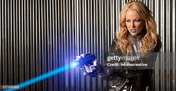 female astronaut space warrior - laser weapon stock pictures, royalty-free photos & images