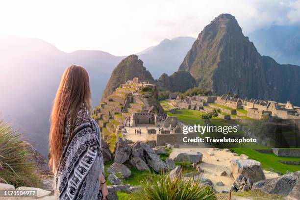girl standing in front of machu picchu peru, south america - machu pichu stock pictures, royalty-free photos & images
