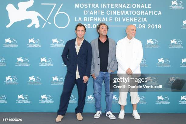 Jude Law, Director Paolo Sorrentino and John Malkovich attends "The New Pope" photocall during the 76th Venice Film Festival at Sala Grande on...