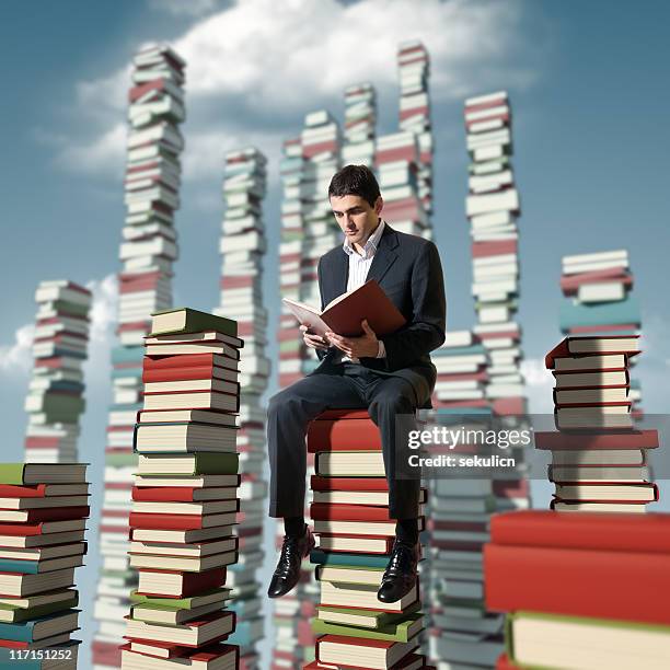 Reaching Books Reading Stack Of Books Photos and Premium High Res Pictures - Getty Images