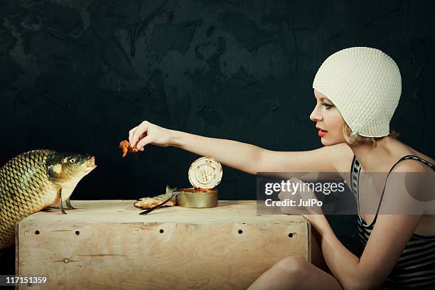 fish feeding - carp stock pictures, royalty-free photos & images