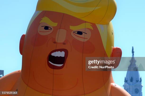 The Baby Trump balloon participates in Peoples March for Puerto Rico, commemorating the second anniversary of Hurricane Marina, at a protest march in...