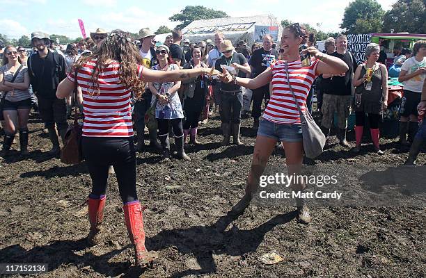 Festival goers dance to a band at the Glastonbury Festival site at Worthy Farm, Pilton on June 23, 2011 in Glastonbury, England. Music fans had to...