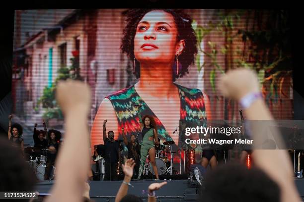 Lellê e Blaya band members pay tribute to murdered Brazilian politician Marielle Franco on the Sunset stage during Rock in Rio 2019 at Cidade do Rock...