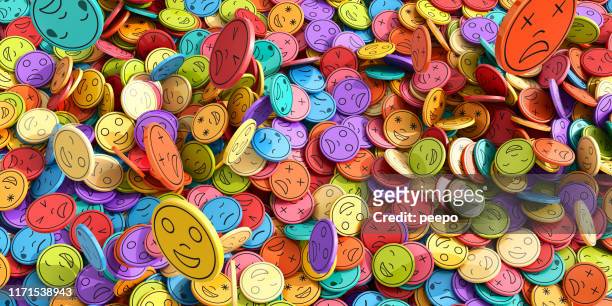 multi-coloured emoji emoticons tokens in mid-air falling into huge pile - emotion stock pictures, royalty-free photos & images