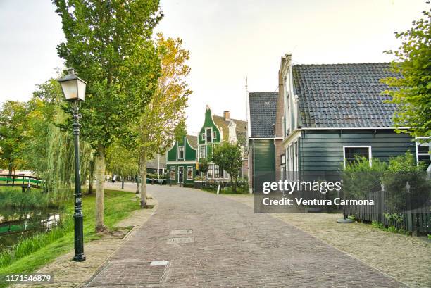 old village street in zaanse schans, netherlands - zaanse schans stock-fotos und bilder