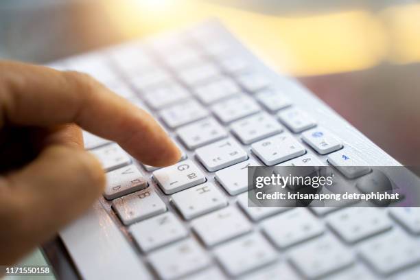 hand keys on a computer keyboard, - tasto-di-computer foto e immagini stock