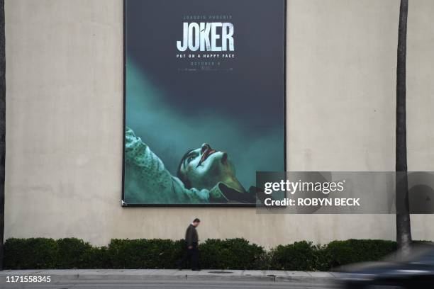 Poster for the upcoming film "The Joker" is seen outside Warner Brothers Studios in Burbank, California, September 27, 2019. - The Los Angeles Police...