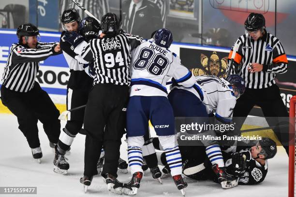 Scuffle breaks out between the Chicoutimi Sagueneens and the Blainville-Boisbriand Armada during the QMJHL game at Centre d'Excellence Sports...