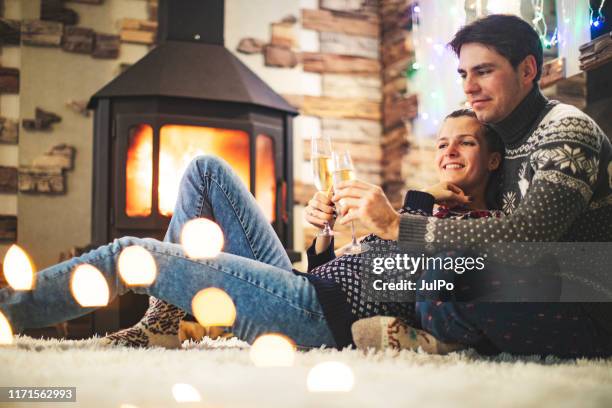 cosy winter holidays - socks fireplace stock pictures, royalty-free photos & images