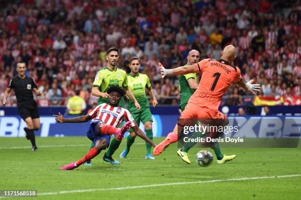 Thomas Partey of Atletico Madrid scores his team's third goal past Marko Dmitrovic of SD Eibar during the Liga match between Club Atletico de Madrid...