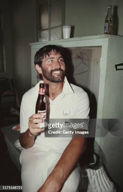 England batsman and man of the match Graham Gooch enjoys a beer in the dressing room after the drawn 5th and final Test Match against the West Indies...