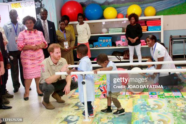 Prince Harry Duke of Sussex meets staff and patients as he visits the Princess Diana Orthopaedic Centre in Huambo, Angola, on day five of the royal...