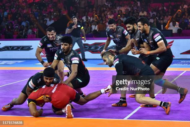 Players of U Mumba and Bengaluru Bulls in action during the Pro Kabaddi League match at SMS Indoor Stadium in Jaipur,Rajasthan, India, Sept 27, 2019.