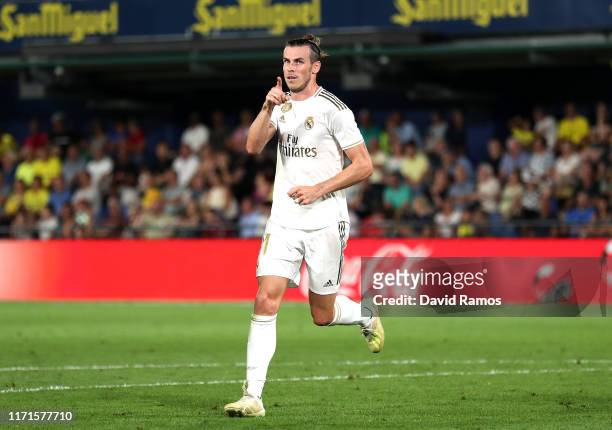 Gareth Bale of Real Madrid celebrates after scoring his sides first goal during the Liga match between Villarreal CF and Real Madrid CF at Estadio de...