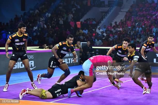 Players of Telgu Titans and Jaipur Pink Panthers in action during the Pro Kabaddi League match at SMS Indoor Stadium in Jaipur,Rajasthan, India, Sept...