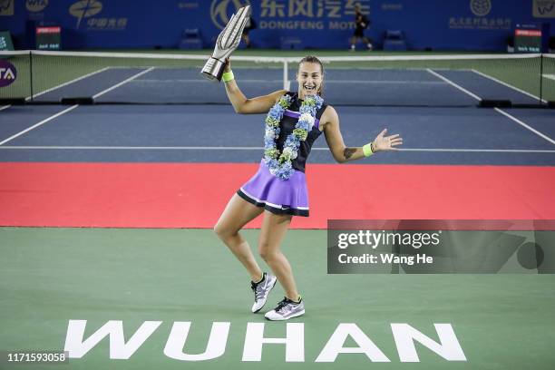 Aryna Sabalenka of Belarus poses with her trophy after defeating Alison Riske of USA during 2019 Wuhan Open singles final match at Optics Valley...