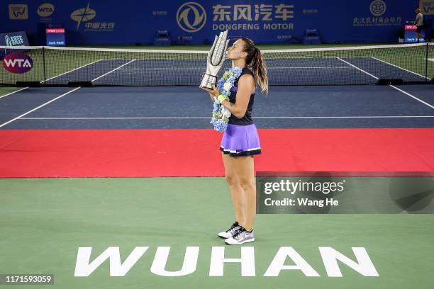 Aryna Sabalenka of Belarus poses with her trophy after defeating Alison Riske of USA during 2019 Wuhan Open singles final match at Optics Valley...