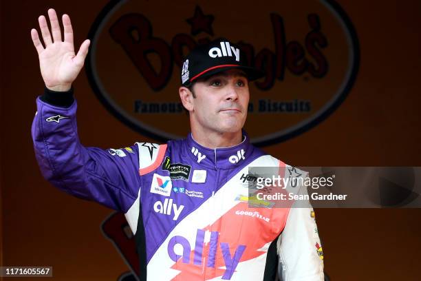 Jimmie Johnson, driver of the Ally Throwback Chevrolet, walks on stage during driver intros for the Monster Energy NASCAR Cup Series Bojangles'...