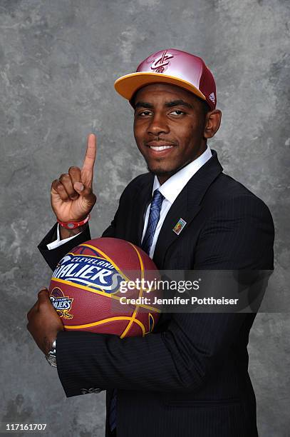 Kyrie Irving selected number one overall by the Cleveland Cavaliers poses for a portrait during the 2011 NBA Draft at The Prudential Center on June...