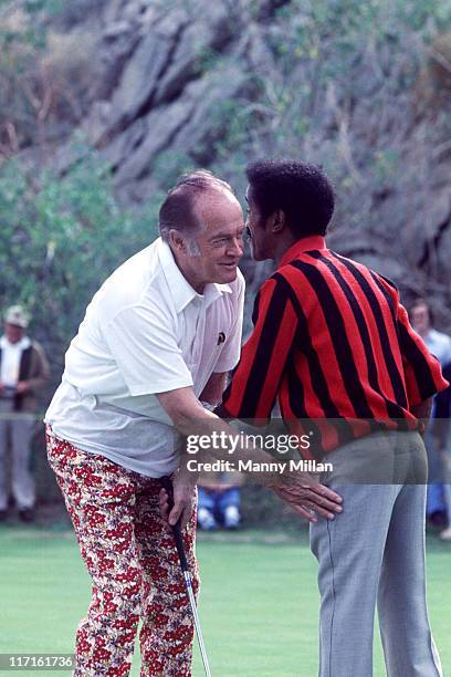 Bob Hope Desert Classic: Bob Hope hugging Sammy Davis Jr. During tournament at Tamarisk CC. Rancho Mirage, CA 2/11/1977 CREDIT: Manny Millan