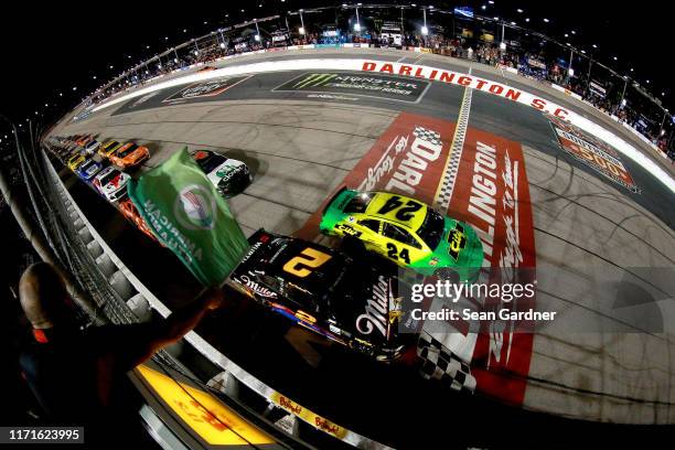 William Byron, driver of the HendrickAutoguard/CityChvrltThrwbck Chev, leads the field to start the Monster Energy NASCAR Cup Series Bojangles'...