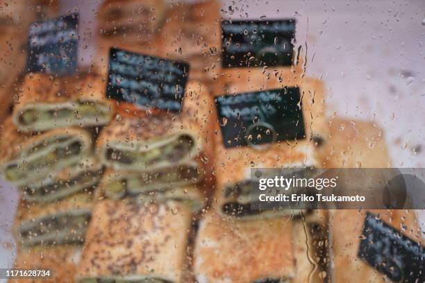 meat pies behind the display case - edinburgh rain stock pictures, royalty-free photos & images