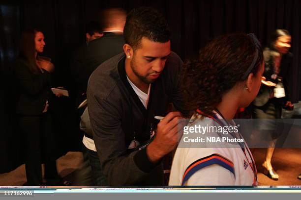 Landry Fields of the New York Knicks signs autographs for fans during the 2011 NBA Draft at The Prudential Center on June 23, 2011 in Newark, New...