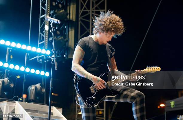 Guitarist Ben Bruce of Asking Alexandria performs during the final night of the Who Do You Trust? tour at the Downtown Las Vegas Events Center on...