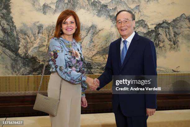 Chinese Vice President Wang Qishan shakes hands with Peruvian Vice President Mercedes Aráoz at Zhongnanhai on September 02, 2019 in Beijing, China.