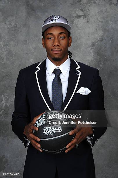 Kawhi Leonard, selected fifteenth by the Indiana Pacers but later traded to the San Antonio Spurs, poses for a portrait during the 2011 NBA Draft at...