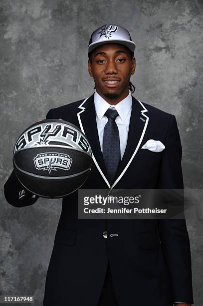 Kawhi Leonard, selected fifteenth by the Indiana Pacers but later traded to the San Antonio Spurs, poses for a portrait during the 2011 NBA Draft at...