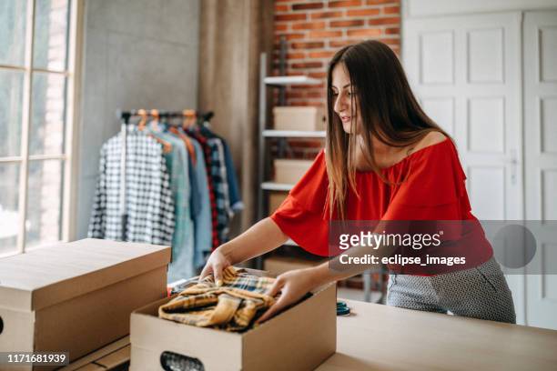 online shopping makes happy a lot of people - clothing donation stock pictures, royalty-free photos & images