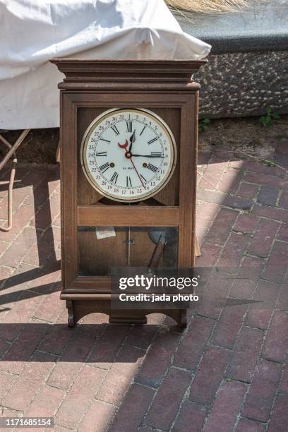 old wall clock in a brown wooden case - wall clock 個照片及圖片檔