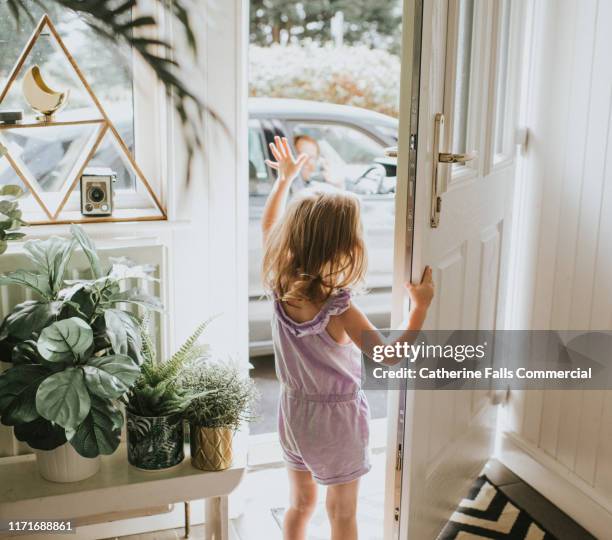 little girl waving - door greeting stock pictures, royalty-free photos & images