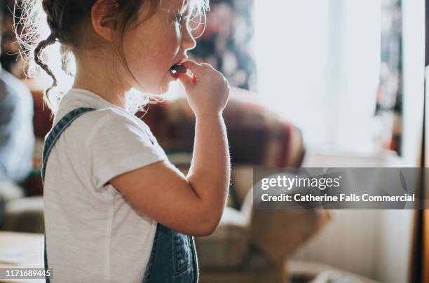 child eating chocolate - toddler food stock pictures, royalty-free photos & images